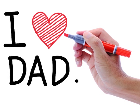 Man's hand writing and drawing heart shape in wording, I love Dad.の写真素材