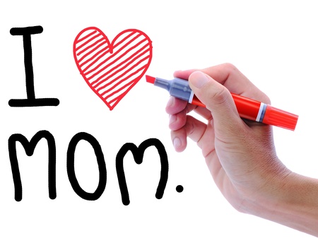 Man's hand writing and drawing heart shape in wording, I love Mom.の写真素材