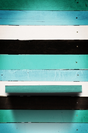 Vintage blue wood wall panel with shelfの写真素材