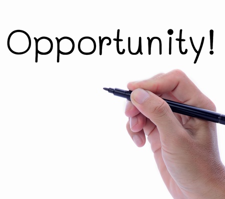Man hand writing word, opportunity, in white space, business concept.の写真素材