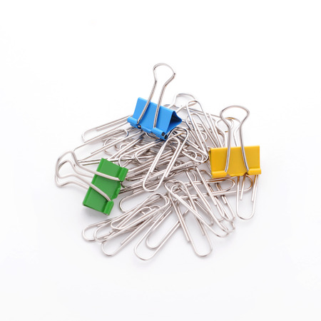 Bunch of color clip board and clip paper isolated on white background, selective focus on the blue one.の写真素材