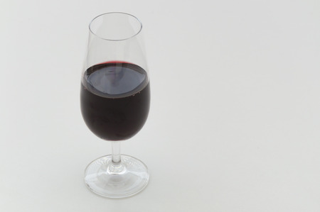 Glass of wine isolated on white backgroundの写真素材