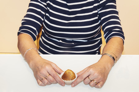 Woman with home made muffinsの写真素材