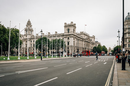 London, UK - August 18, 2015: Parliament Square a cloudy day of summer with a crowd of tourists.  London is one of the most visited cities in the world.のeditorial素材