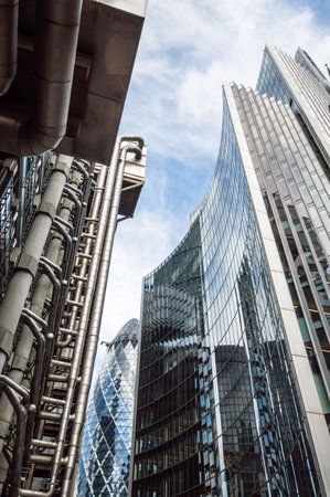 LONDON, UK - AUGUST 21, 2015:  Low angle view of some buildings in the City of London: Lloyds, Willis and Gherkin Towerのeditorial素材