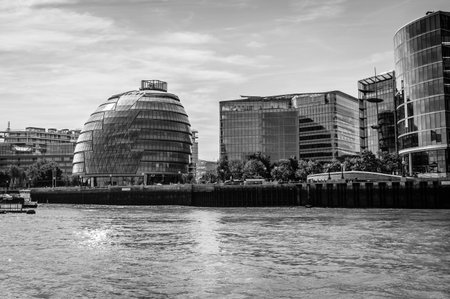 LONDON, UK - AUGUST 22, 2015: London City Hall from the river a sunny day. Black and white artistic image. It was designed by architect Norman Fosterのeditorial素材