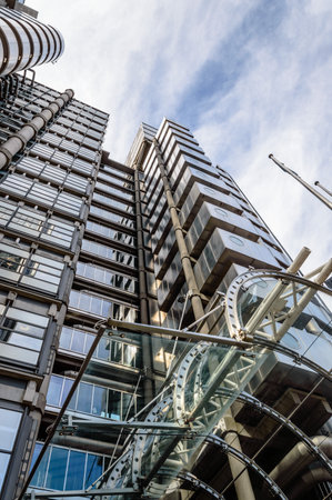 LONDON, UK - AUGUST 21, 2015:  Low angle view of  the entrance of Lloyds building  - home of insurance institution Lloyd of London. Like Pompidou Centre in Paris was designed by Rogers and completed on 1986.のeditorial素材