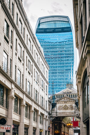 LONDON, UK - AUGUST 21, 2015:  Street in the city of London with the contrast  between historical buildings and new skyscrapers at Leadenhall Marketのeditorial素材