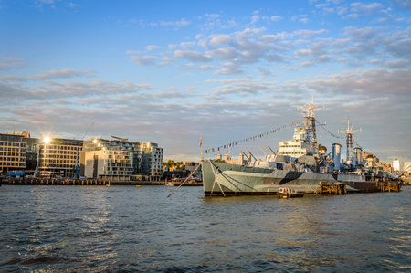 LONDON, UK - AUGUST 21, 2015: London cityscape at sunset. View from City Hall with warship on the foregoundのeditorial素材