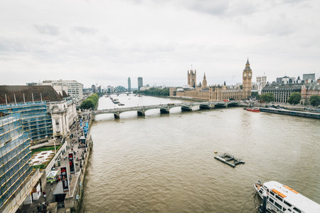 LONDON, UK - AUGUST 23, 2015: London cloudy morning. London eye,  Westminster Bridge, Big Ben and Houses of Parliament.のeditorial素材
