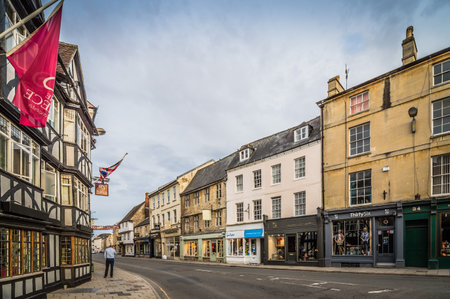 CIRENCESTER, UK - AUGUST 11, 2015:  Town of Cirencester at sunset. Cirencester is a market town in the Cotswolds.のeditorial素材