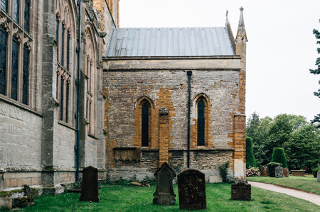 Tombstones at an old graveyard in the Holy Trinity Church in Stratford Upon Avon, UK. Cloudy dayの写真素材
