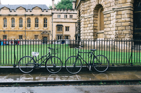 Oxford, UK - August 12, 2015: Bicycles parked in the fence of Radcliffe Camera in Oxford. The city is known as the home of the University of Oxford.のeditorial素材