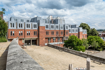 Winchester, UK - August 16, 2015: Outdoors view of Modern office building in the center of the city a cloudy day.  Winchester is the ancient capital of England and former seat of King Alfred the Great.のeditorial素材