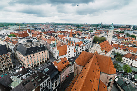 Munich, Germany - May 05, 2015: Aerial cityscape from the tower a cloudy day. City hall, Cathedral (Frauenkirche) and St Peters church are around MarienPlatz, the first touristic and commercial attraction in Munich.のeditorial素材