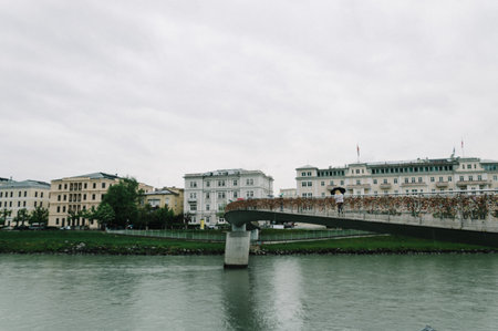 Salzburg, Austria - April 30, 2015:   Salzach river and bridge. Salzburg is renowned for its baroque architecture and was the birthplace of Mozart. It is an Unesco World Heritage Site.のeditorial素材