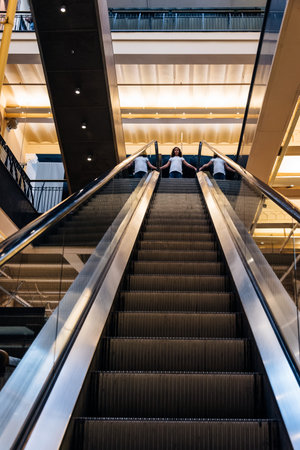 Amsterdam, Netherlands - August 1, 2016: Low angle view of escalators of the lobby of Magna Plaza Shopping Center in Amsterdam.  Indoor viewのeditorial素材
