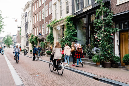 Amsterdam, Netherlands - August 2, 2016: Street in historical city center of Amsterdam. It is one of the most romantic and beautiful cities in Europe.  Amsterdam is also a city of tolerance and diversity.のeditorial素材