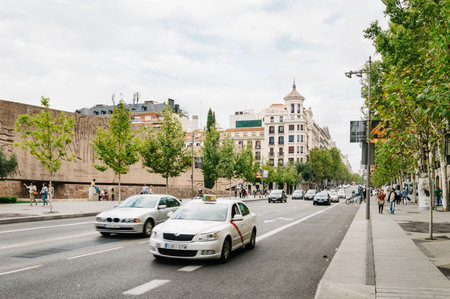 Madrid, Spain - September 27, 2014: Serrano Street in Madrid. It is a travel destination for shopping on its many luxury boutiques. Traffic a cloudy dayのeditorial素材