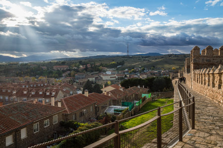 Avila, Spain - November 11, 2014:  Cityscape of Avila from Medieval Walls a cloudy day at sunset. The old city  and its extramural churches were declared a World Heritage site by UNESCOのeditorial素材