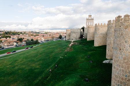 Avila, Spain - November 11, 2014:  Cityscape of Avila from Medieval Walls a cloudy day at sunset. The old city  and its extramural churches were declared a World Heritage site by UNESCOのeditorial素材