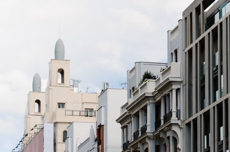 Madrid, Spain - September 18, 2016:   Low angle view of  buildings at Gran Via Street in Madrid. It is an important street in Central Madrid with shops and theaters.のeditorial素材