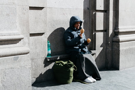 Madrid, Spain - September 18, 2016:  Unindentified man beggar asked for money on a busy street in the center of Madridのeditorial素材