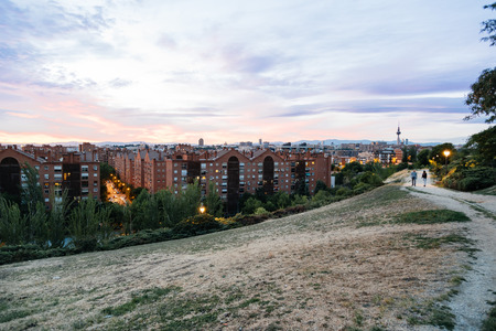 Madrid cityscape at dusk from a residential district and mountain range at backgroundの写真素材