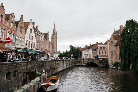 Bruges, Belgium - July 29, 2016: Canal scene in the city of Bruges. The historic city centre is a World Heritage Site of UNESCO. It is known for his picturesque cobbled lanes and dreamy canalsのeditorial素材