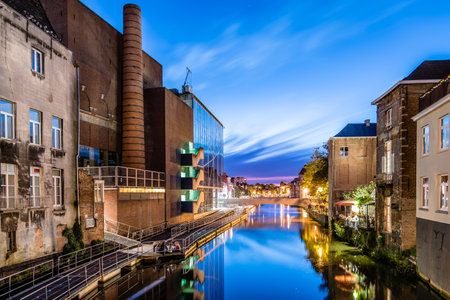 Mechelen, Belgium - July 29, 2016: Cityscape of Mechelen from the canal at sunset. Mechelen is one of most prominent cities of historical art in  Flandersのeditorial素材