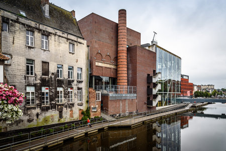 Mechelen, Belgium - July 30, 2016: Lamot conference centre situated at the waterside, in the historic centre of Mechelen. The former brewery is one of the most daring feats of contemporary architecture.のeditorial素材