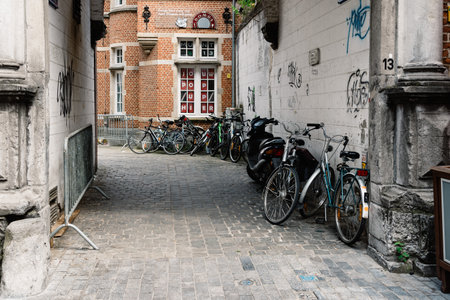 Leuven, Belgium - July 30, 2016: Alley with bicycles parked in historical centre of Leuvenのeditorial素材