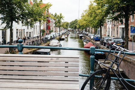 Haarlem, Netherlands - August 3, 2016: Picturesque cityscape with beautiful traditional houses and vessels in canal of Haarlemのeditorial素材