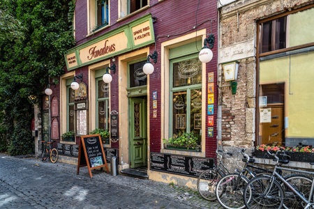 Ghent, Belgium - July 31, 2016: Picturesque restaurant with bicycles parked and flowers in Ghentのeditorial素材