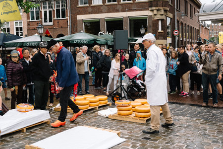 Gouda, Netherlands - August 4, 2016: Gouda Cheese Market. It remains a spectacle at the heart of Hollands cheese industry, with its rituals and Dutch traditions now a must-see attraction.のeditorial素材
