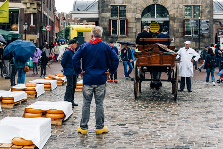 Gouda, Netherlands - August 4, 2016: Gouda Cheese Market. It remains a spectacle at the heart of Hollandâs cheese industry, with its rituals and Dutch traditions now a must-see attraction.のeditorial素材