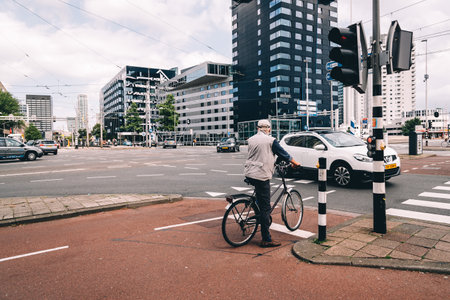 Rottedam, The Netherlands - August 6, 2016: Rotterdam cityscape and car traffic in a crossroads....