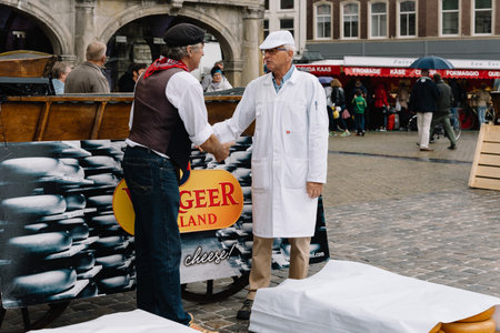 Gouda, Netherlands - August 4, 2016: Gouda Cheese Market. It remains a spectacle at the heart of HollandÃ¢ï¿½ï¿½s cheese industry, with its rituals and Dutch traditions now a must-see attraction.のeditorial素材