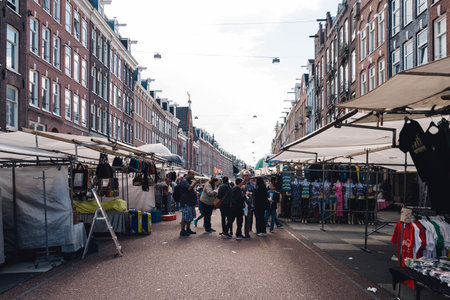 Amsterdam, Netherlands - August 09, 2016 Unidentified people in street market in Oude Pijp neighborhood in Amsterdam a cloudy day of summerのeditorial素材