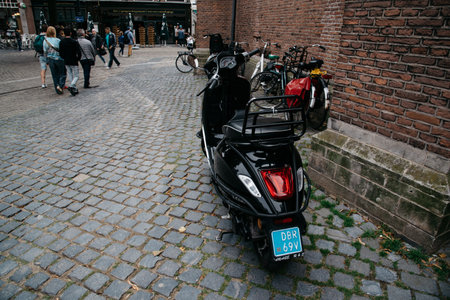 The Hague, The Netherlands - August 7, 2016: Scooter parked in a   street in the Hague city centre. The Hague is the seat of the Dutch government and multiple international organizations.のeditorial素材
