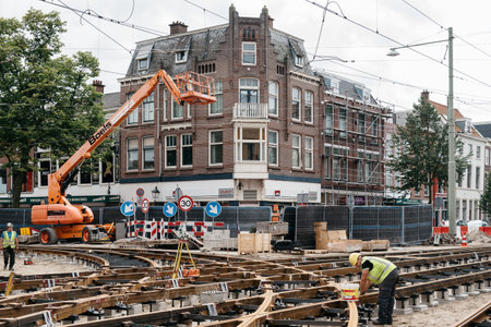 The Hague, The Netherlands - August 7, 2016: View of construction site for repairing tram tracks in the city centre of the Hague. The Hague is the seat of the Dutch government and multiple international organizations.のeditorial素材