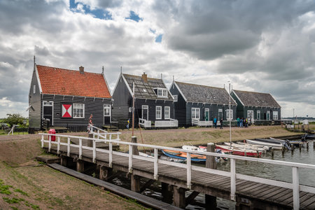 Marken, Netherlands - August 08, 2016. Picturesque traditional houses in the fishing harbour of Marken. It is known for its characteristic wooden houses and traditional costumes.のeditorial素材