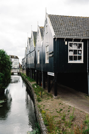 Marken, Netherlands - August 08, 2016. Picturesque traditional houses in Marken. It is known for its characteristic wooden houses and traditional costumes.のeditorial素材
