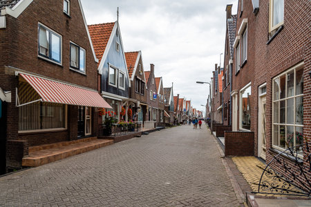 Veolendam, Netherlands - August 08, 2016. Main street of Volendam. Volendam is a popular tourist attraction in the Netherlands, well known for its old fishing boats and the traditional clothing still worn by some residentsのeditorial素材