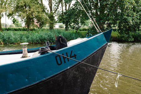 Monnickendam, Netherlands - August 08, 2016. Ship moored in the canal of Monnickendam. The town was founded by monks and it is a small fishing village today,のeditorial素材