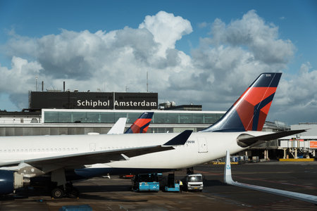 Amsterdam, Netherlands - August 10, 2016. Schiphol Airport.  Airplanes parked on airport runway. It is the main international airport of the Netherlandsのeditorial素材