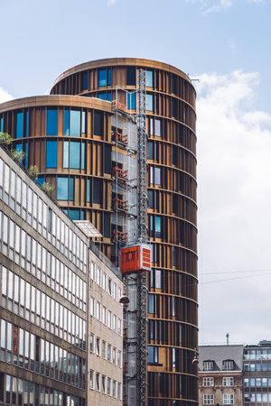 Copenhagen, Denmark - August 10, 2016.  Modern office building under construction against cloudy sky in financial district of Copenhagenのeditorial素材