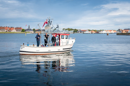 Copenhagen, Denmark - August 10, 2016. Boat with tourists sailing in the port of Copenhagen near sunset on summerのeditorial素材