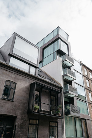 Copenhagen, Denmark - August 12, 2016. Low angle view of modern residential building in in historical city centre of Copenhagen a cloudy day of summerのeditorial素材