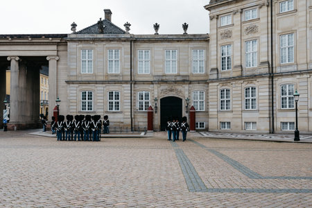 Copenhagen, Denmark - August 12, 2016:  Soldiers of the Danish Royal Life Guards for the changing of the guards on the central plaza of Amalienborg palace in Copenhagen. It is the home of the Danish royal family.のeditorial素材
